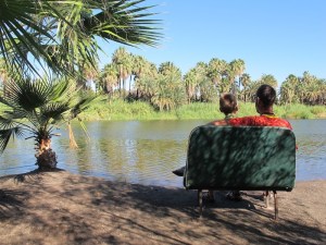 Sitting on a bus seat by the lagoon