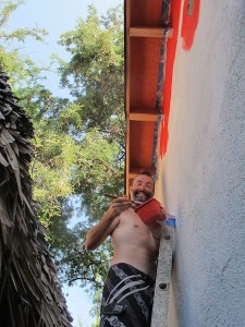 Brendo painting one of the casitas