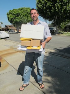 Paul with 12 parcels that we had sent to his address in Huntington Beach, California