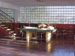 An infamous shot for touring cyclists, the big guy asleep on the pool table