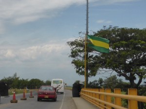 Check out the guy hanging out of the window of the red car. He was whooping all the way down the road.