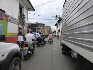 Seriously. Look at that truck up ahead holding up traffic. A wardrobe and a fridge on the back, and the roof covered in cases of beer!