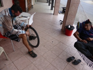 We finish our last day riding in Ecuador and no joke, as we roll into town we get a puncture